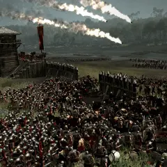 La batalla de Alesia en pleno apogeo. Legiones romanas asedian una fortaleza gala, con fuego y humo en el cielo.