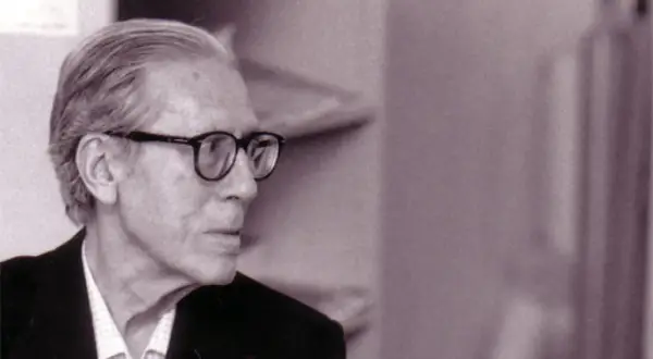 Retrato de José Luis Cano, hombre mayor con gafas, mirando hacia la izquierda.