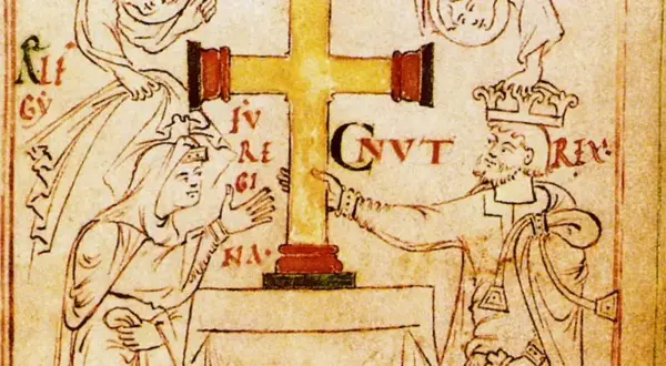 Ilustración medieval de Canuto el Grande, un rey con corona, señalando una cruz dorada.