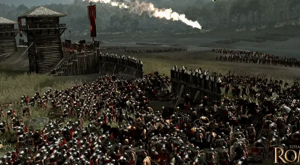 La batalla de Alesia en pleno apogeo. Legiones romanas asedian una fortaleza gala, con fuego y humo en el cielo.