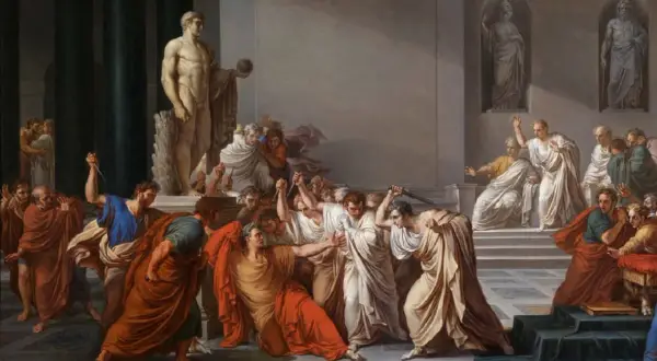 El asesinato de Julio César: hombres con togas atacan a César con dagas en un salón con estatuas.
