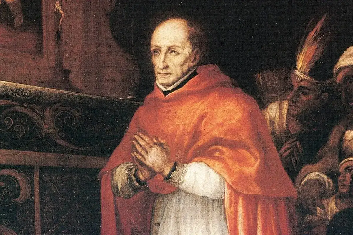 Retrato de Santo Toribio de Mogrovejo, arzobispo, con las manos juntas en oraci&oacute;n. A su lado, figuras con vestimentas ind&iacute;genas.