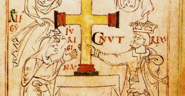 Ilustración medieval de Canuto el Grande, un rey con corona, señalando una cruz dorada.